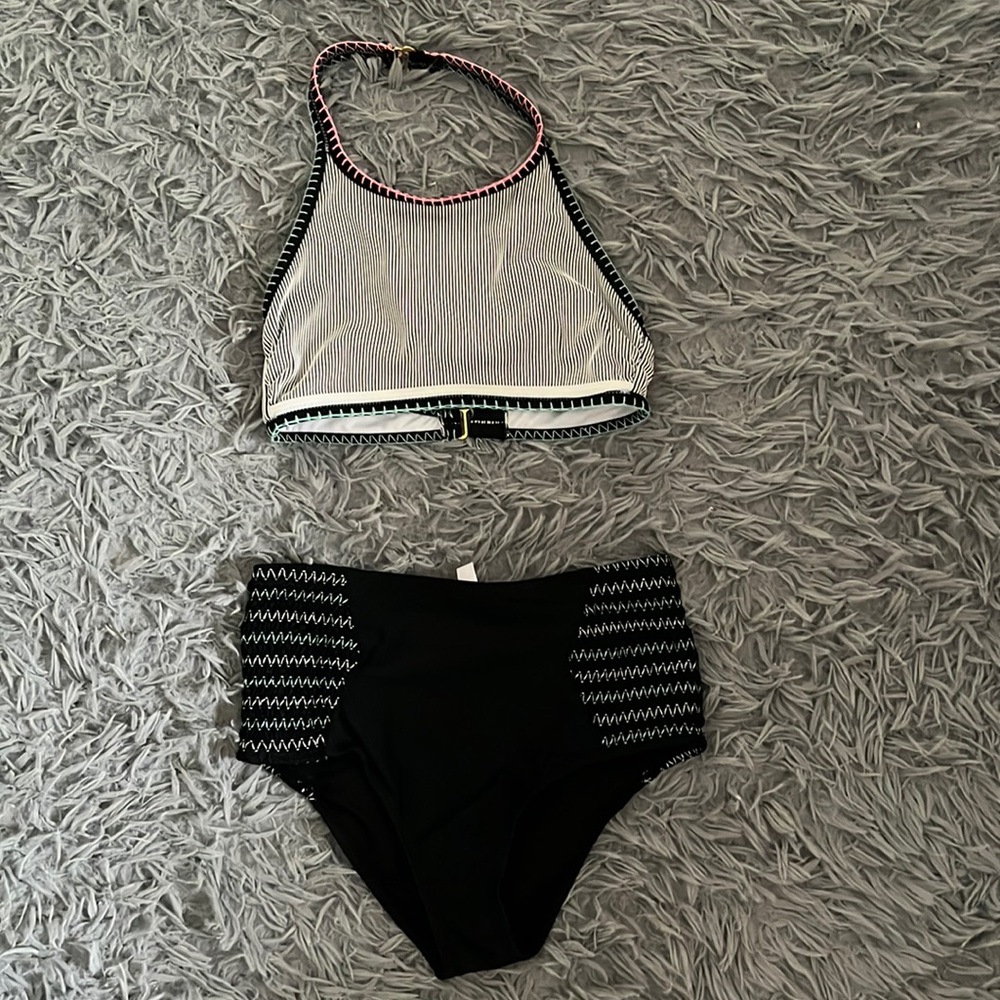 High waisted small bathing suit bottoms and a small bathing suit halter top